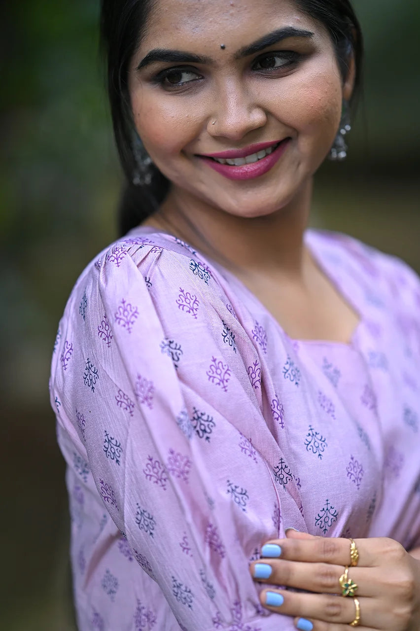 Cap sleeve detail of Adithi Silks floral midi kurti styled for office wear